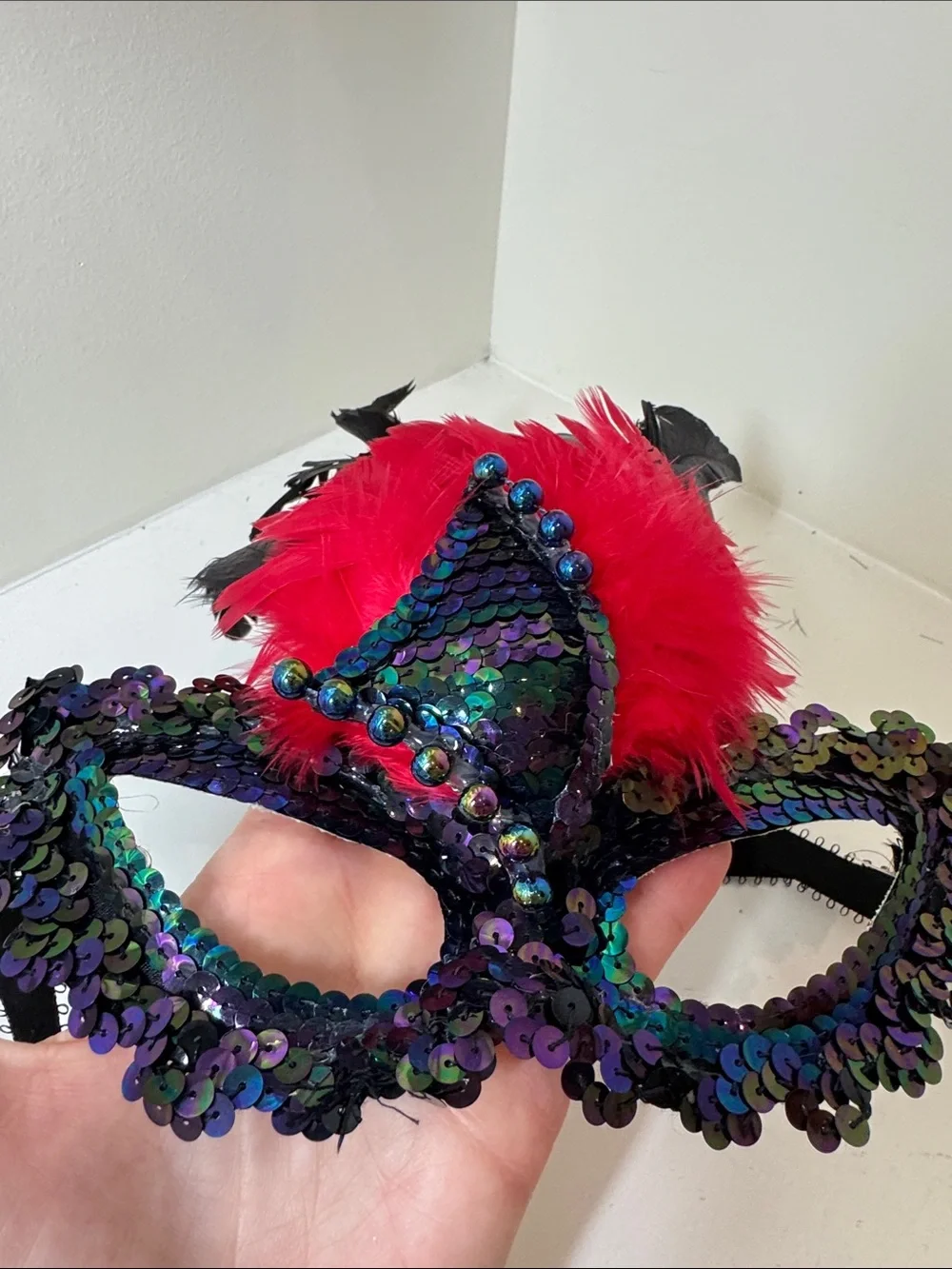Handmade sequined and feathered mask from New Orleans.